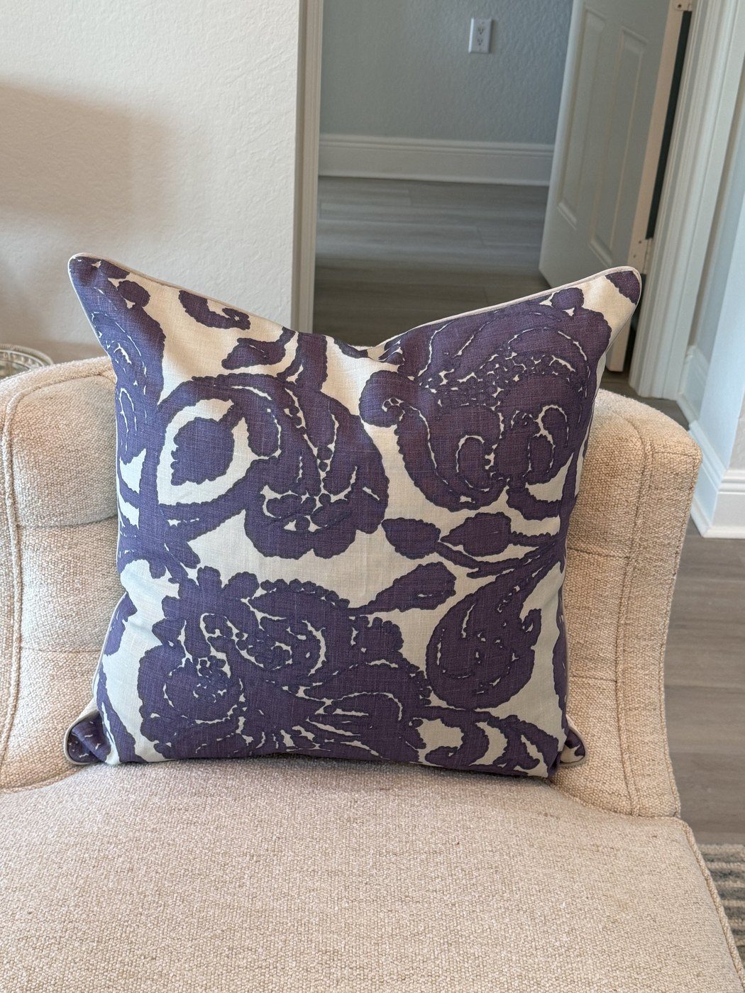 Arabesque Plum purple block print pillow styled on armchair by PepperTree Designs