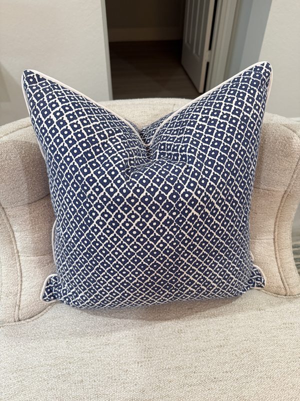 Arbre navy and white pillow on armchair