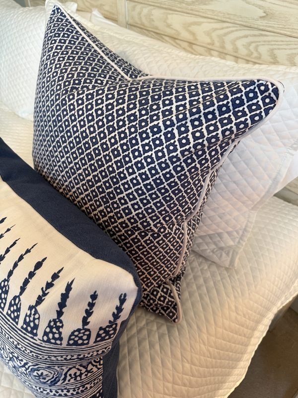 Arbre pillow styled with Javanese Stripe navy lumbar on bed