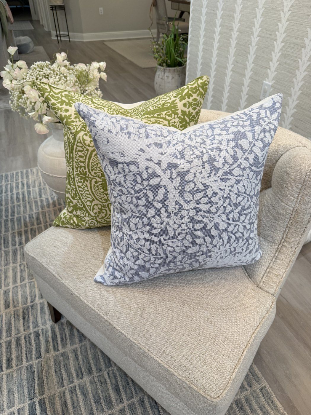 Arbre de Matisse pillow with green block print pillow on chair