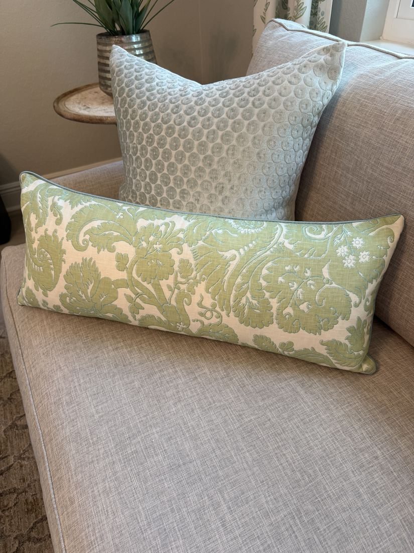 Borghese green lumbar pillow styled on sofa