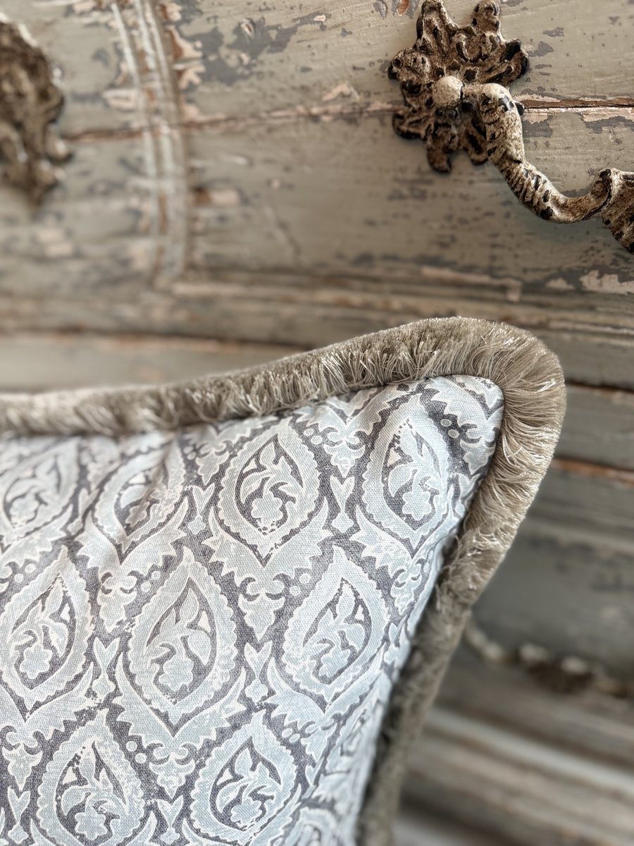 Broadway pillow fringe corner detail on distressed console