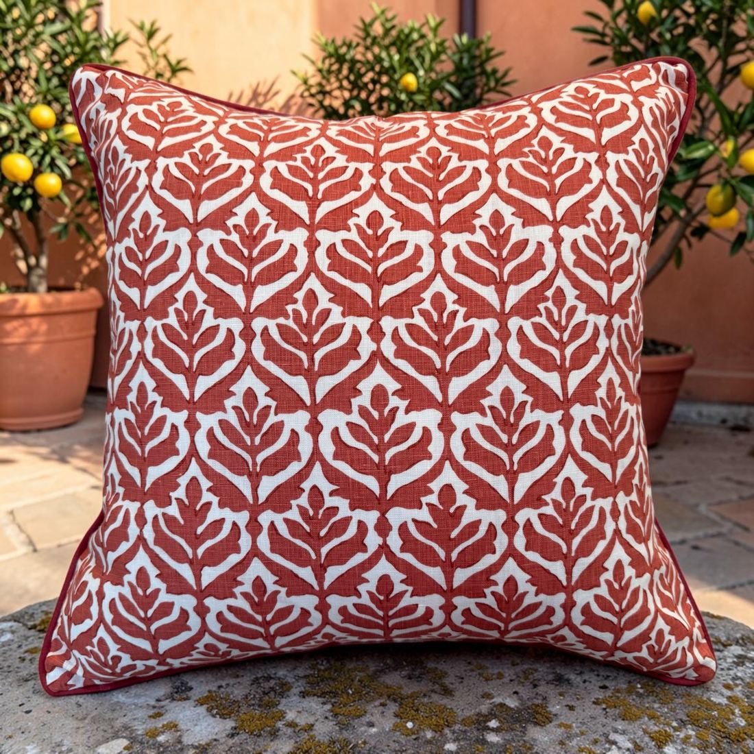Cameron coral red Stroheim linen pillow styled outdoors