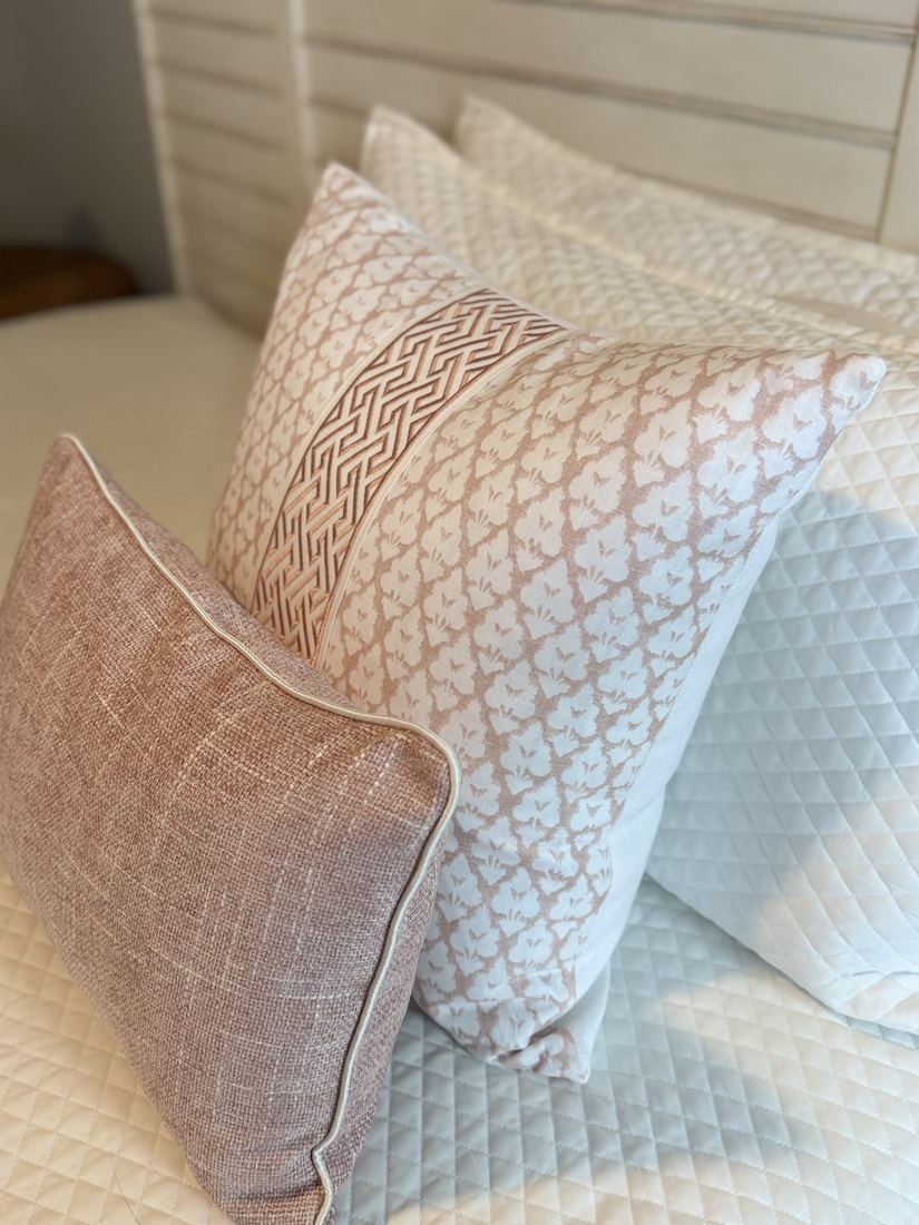 Jennifer blush pillow styled on bed