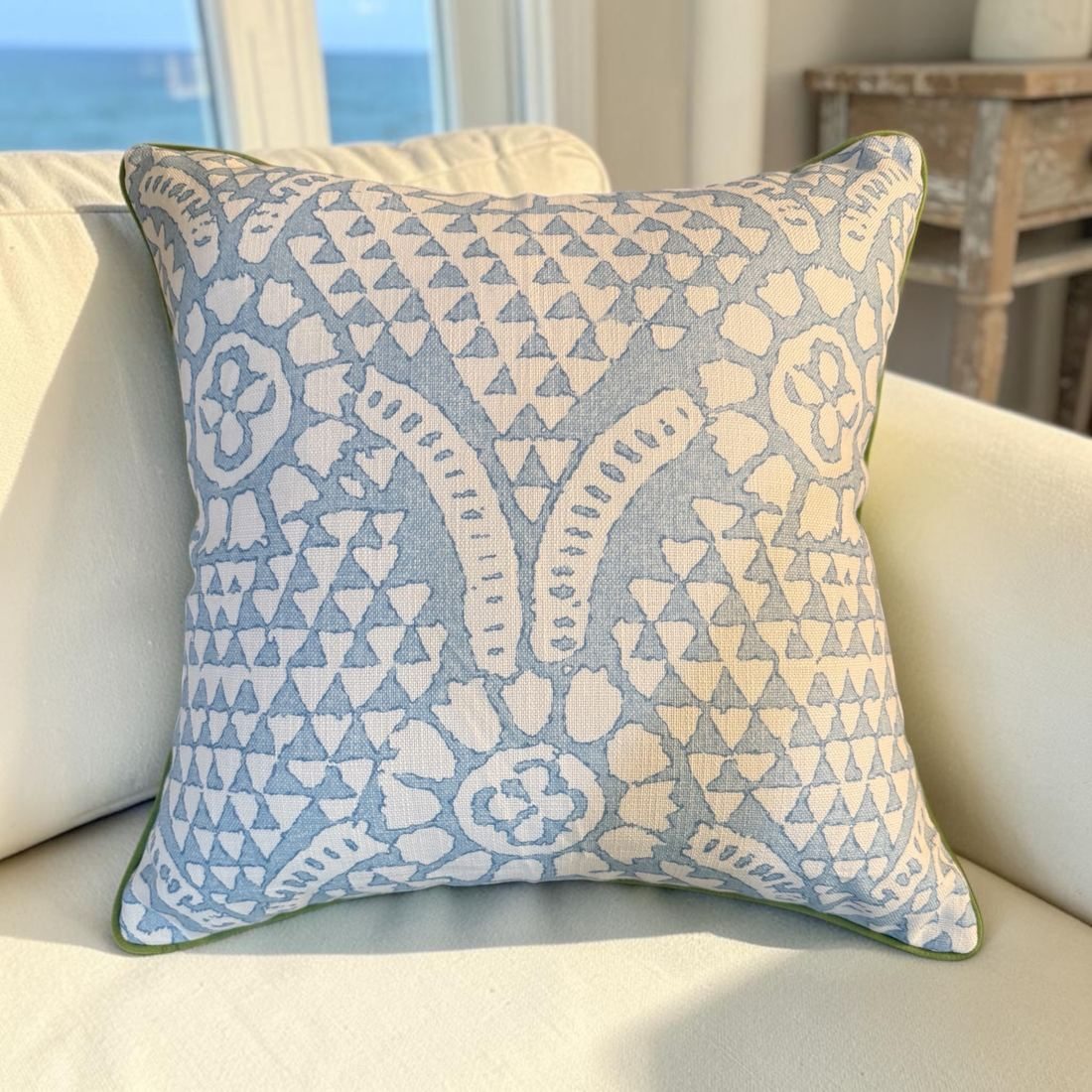 Chamomile spa blue block print pillow styled on sofa