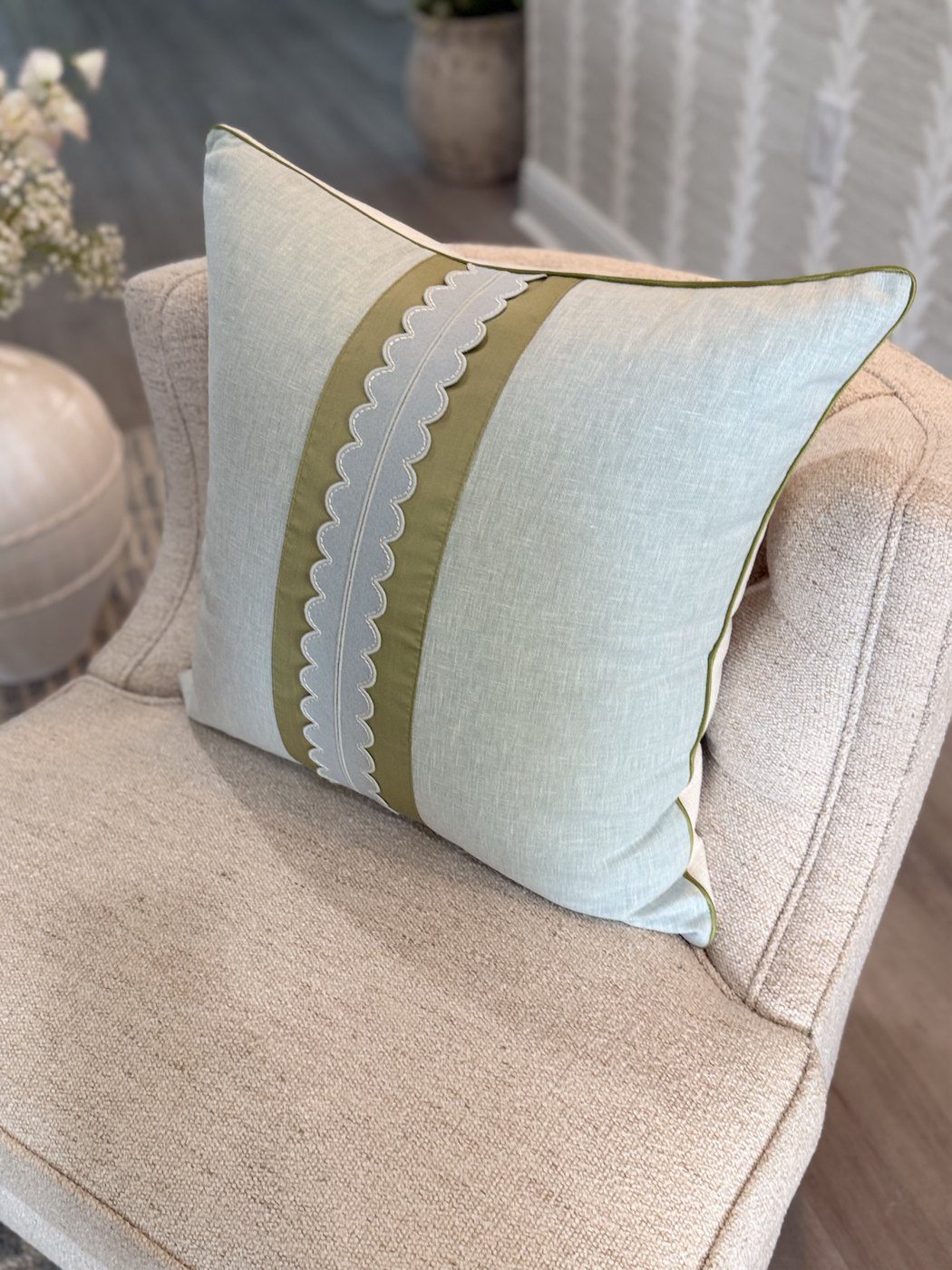 Coastal Scallop pillow angled view with sage green band and scallop tape