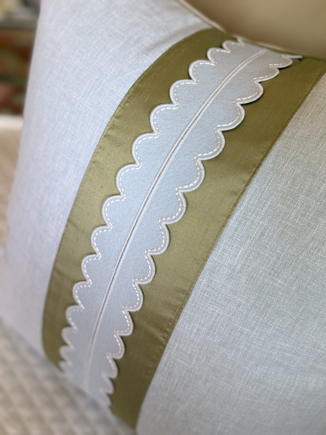 Coastal Scallop pillow stitched scallop trim and sage band close-up