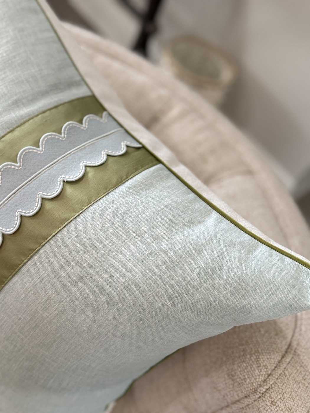 Coastal Scallop pillow corner detail with green piping