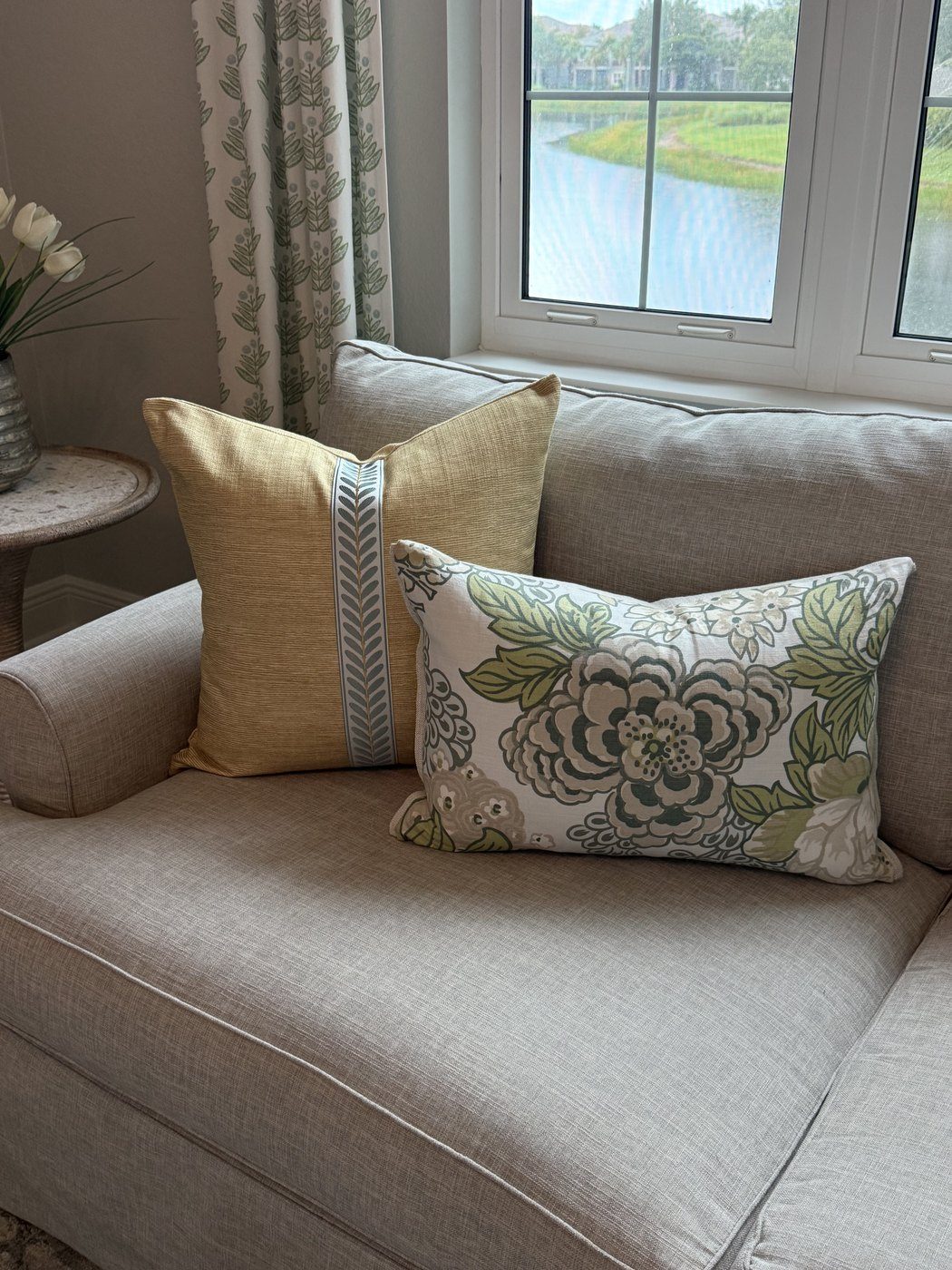 Cornflower Stripe gold pillow with floral lumbar on sofa