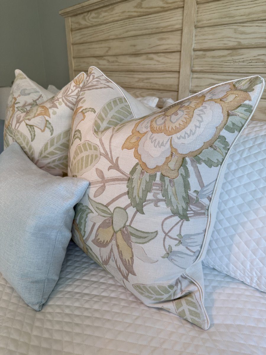 Davenport Lee Jofa floral pillows styled on bed with headboard