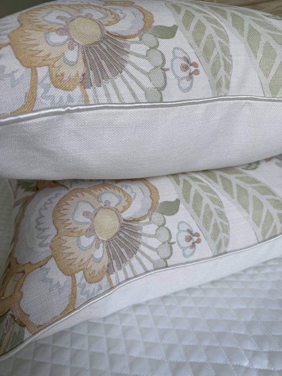 Davenport pillows stacked showing ivory silk trim and floral linen