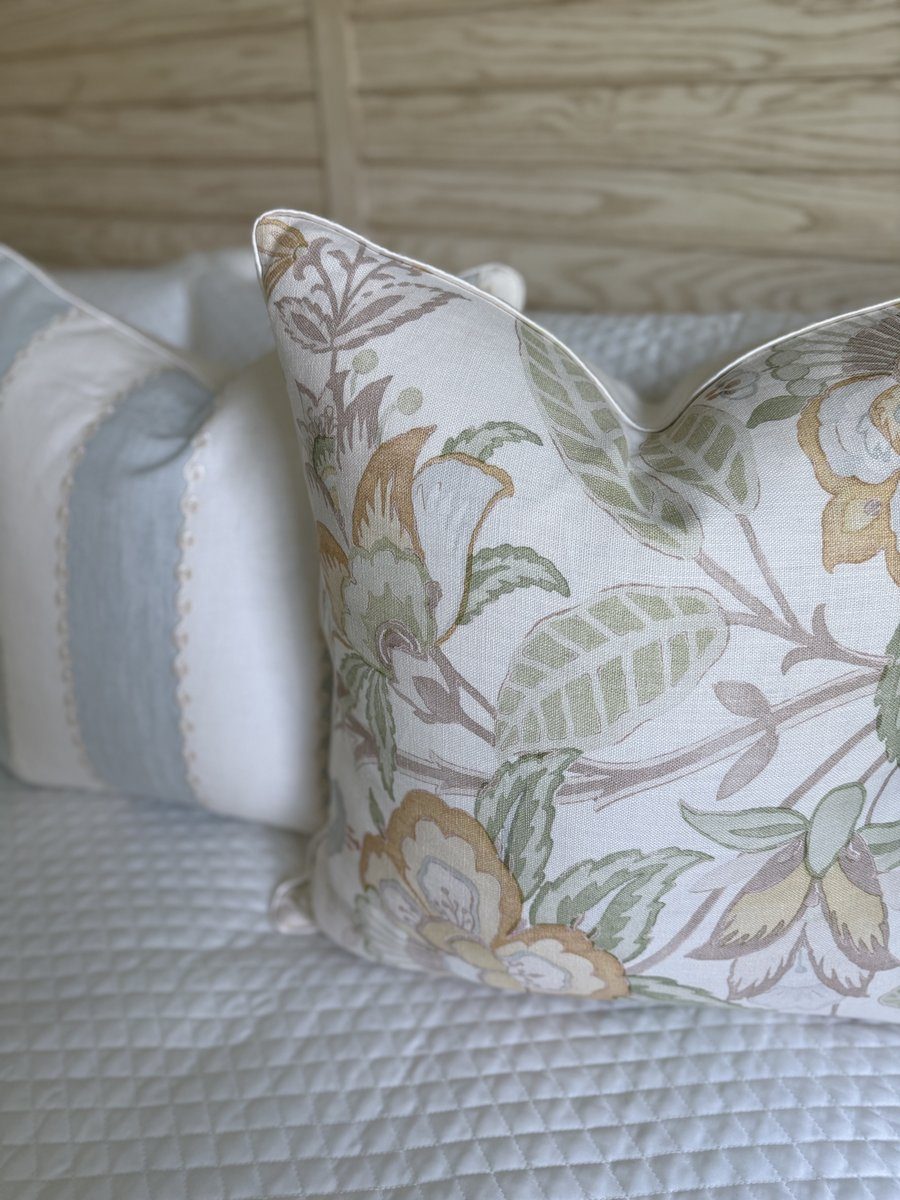 Davenport pillow angled view with soft floral print and ivory trim