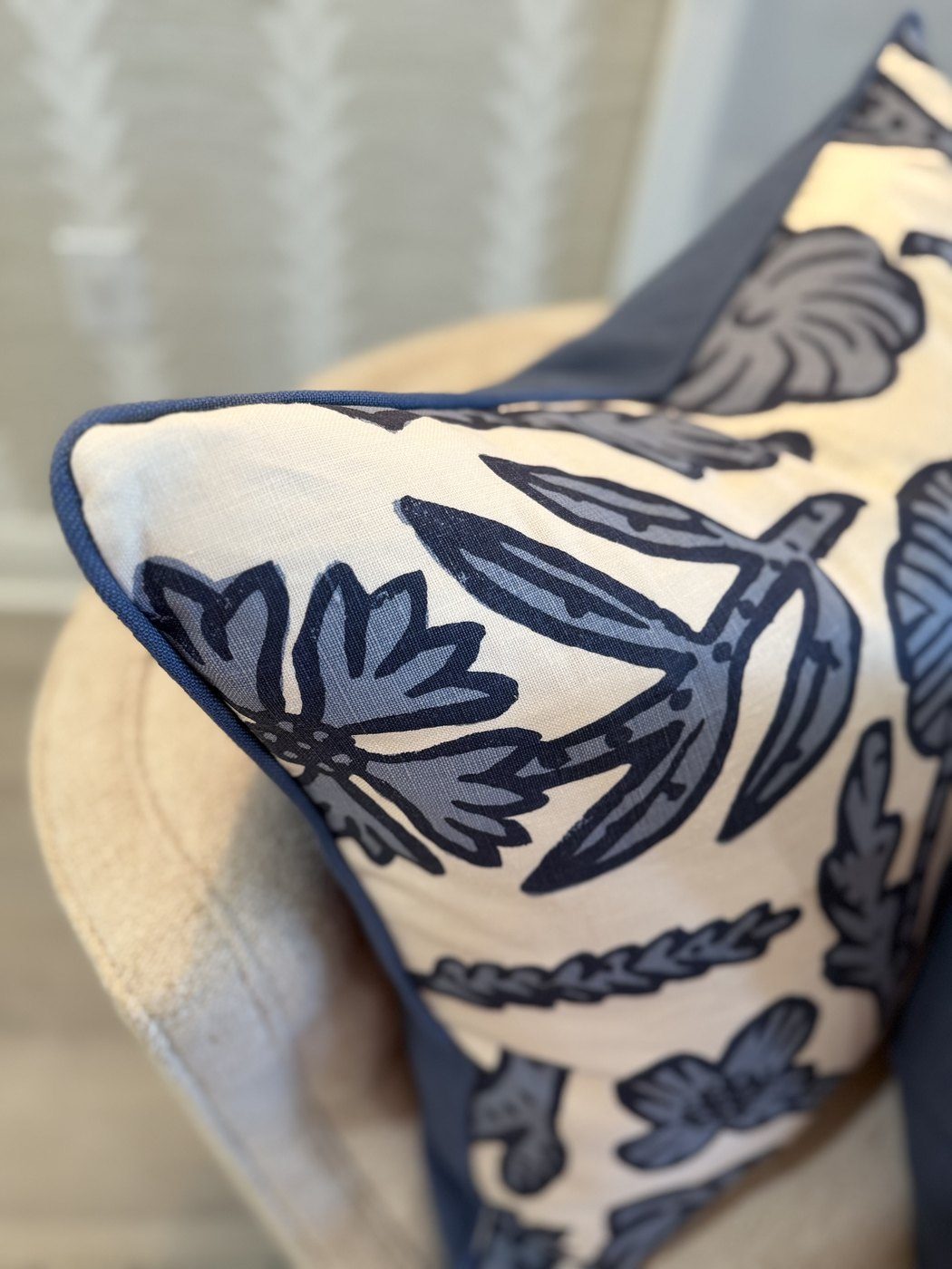 Day Floral ink pillow corner with blue linen backing on armchair