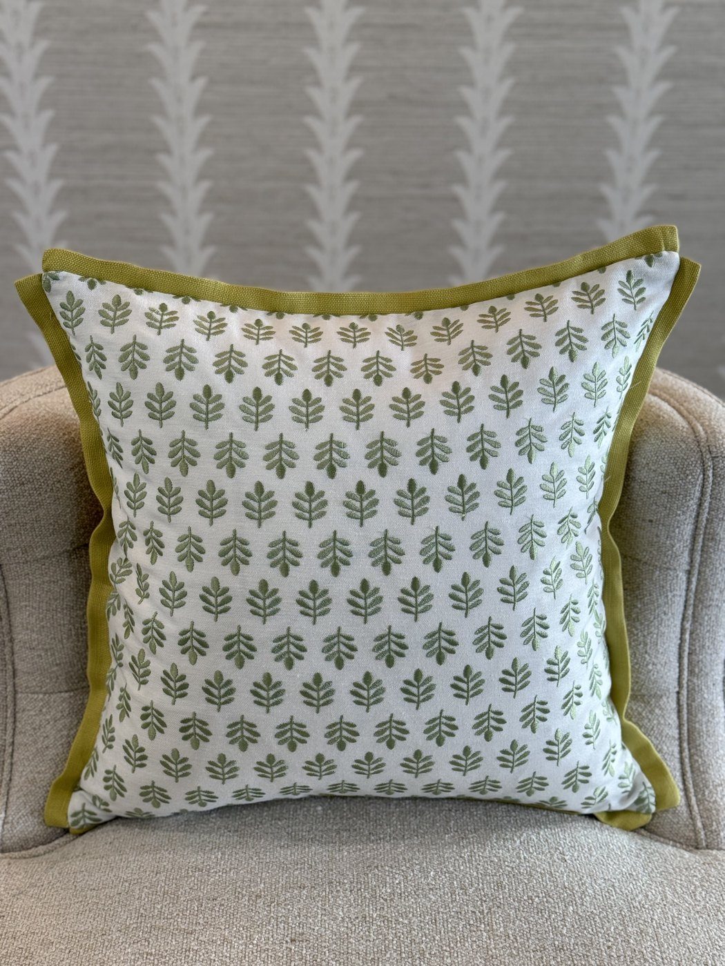 Embroidered Tulips pillow with chartreuse flange on armchair by PepperTree Designs
