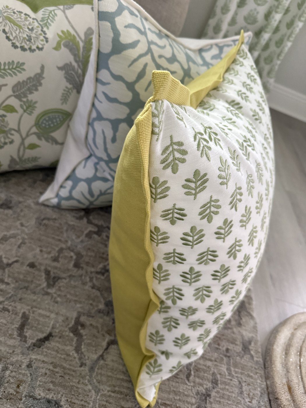 Embroidered Tulips pillow side view showing chartreuse backing and flange