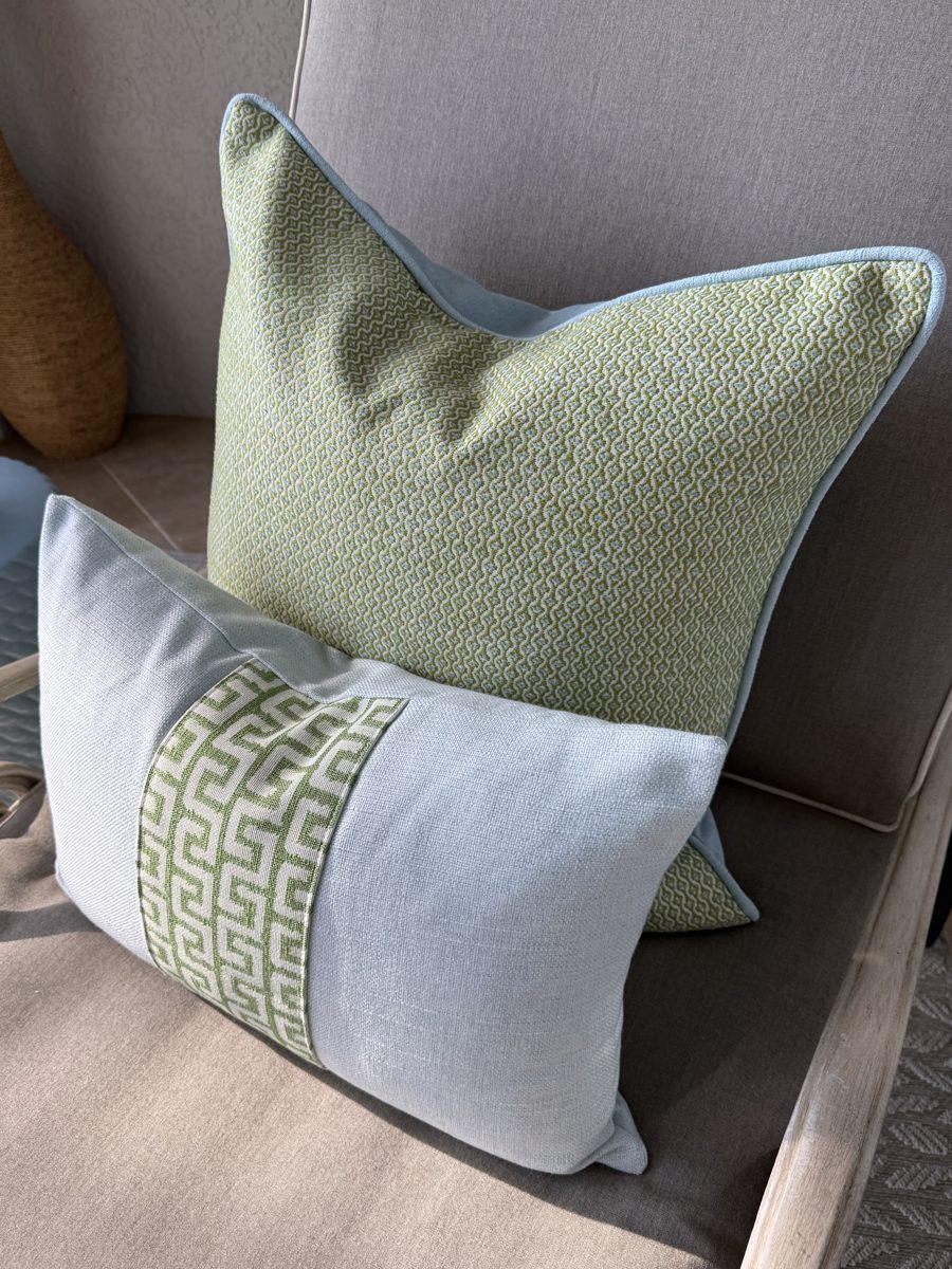 Gertrude indoor outdoor pillow paired with Athena lumbar on chair