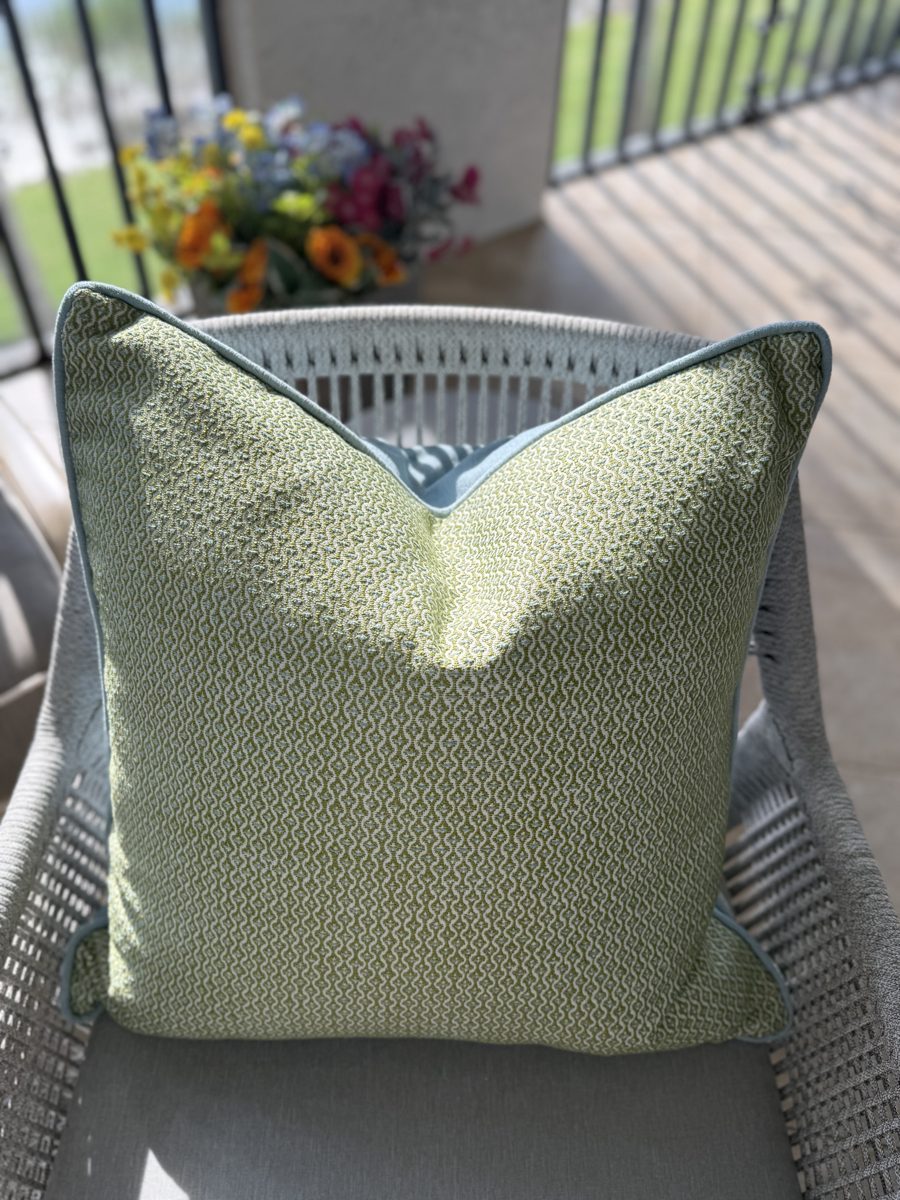 Gertrude indoor outdoor pillow styled on patio chair by PepperTree Designs