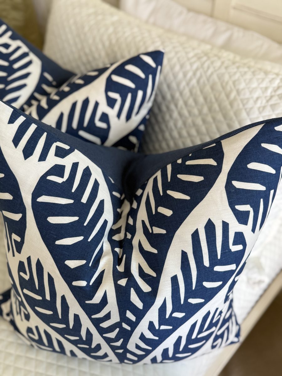 Ginger pair of navy palm pillows overhead detail