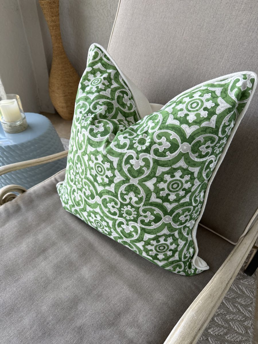 Hampton green medallion pillow angled view on armchair