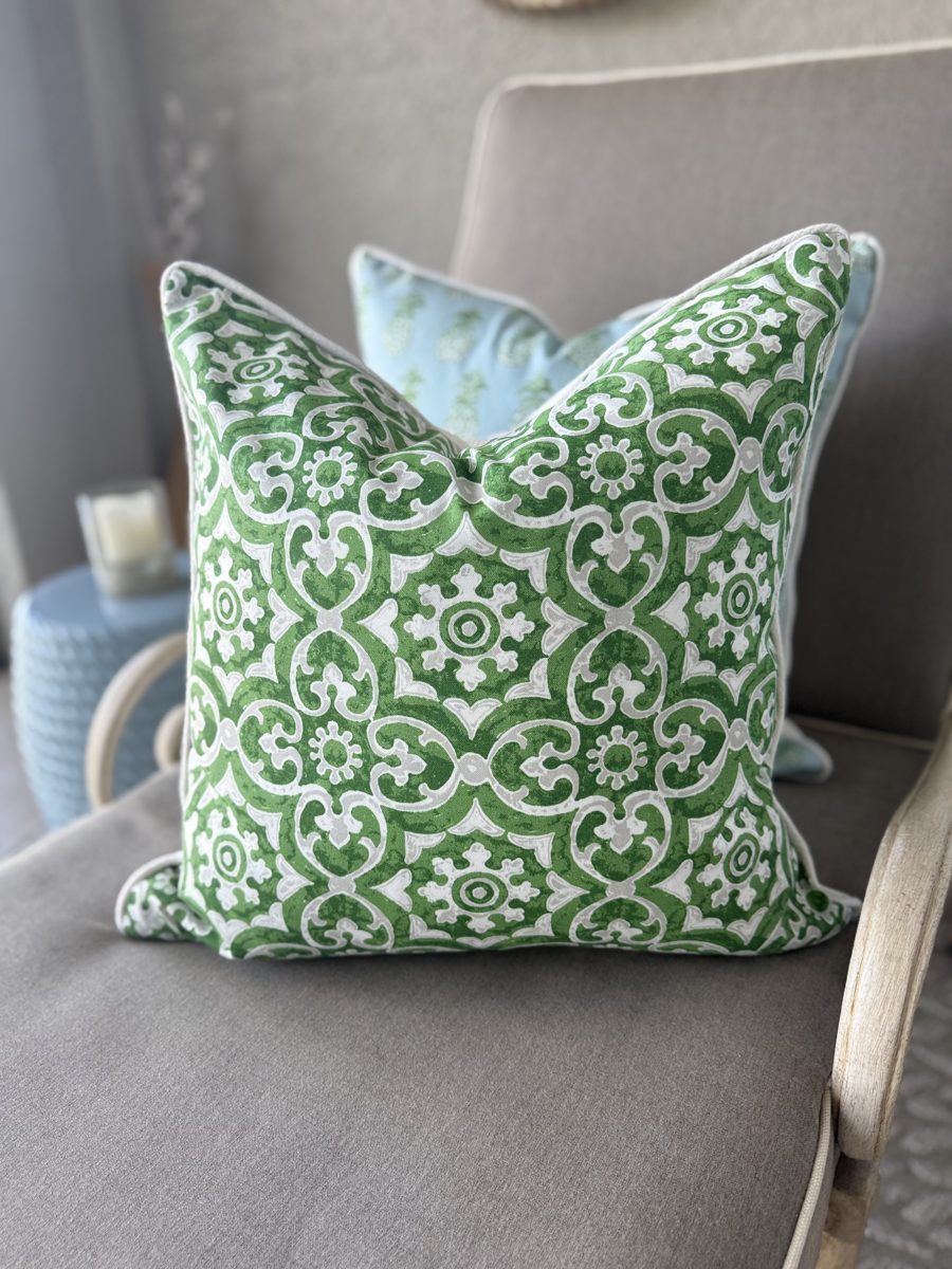 Hampton green grey and white pillow styled on chair with Pina Cove by PepperTree Designs