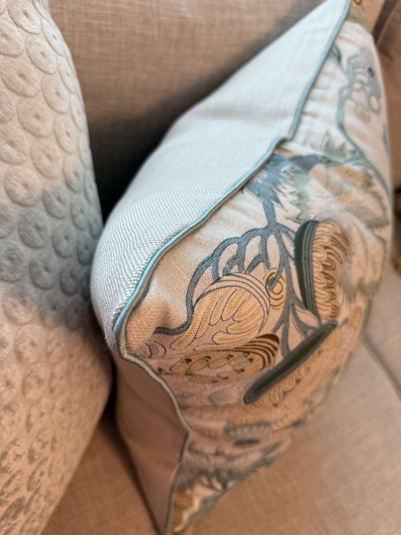 Indienne Jacobean pillow corner detail with blue piping