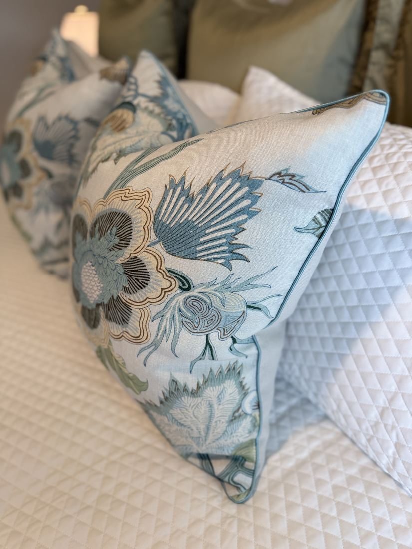 Indienne Jacobean pillow pair styled on bed close up