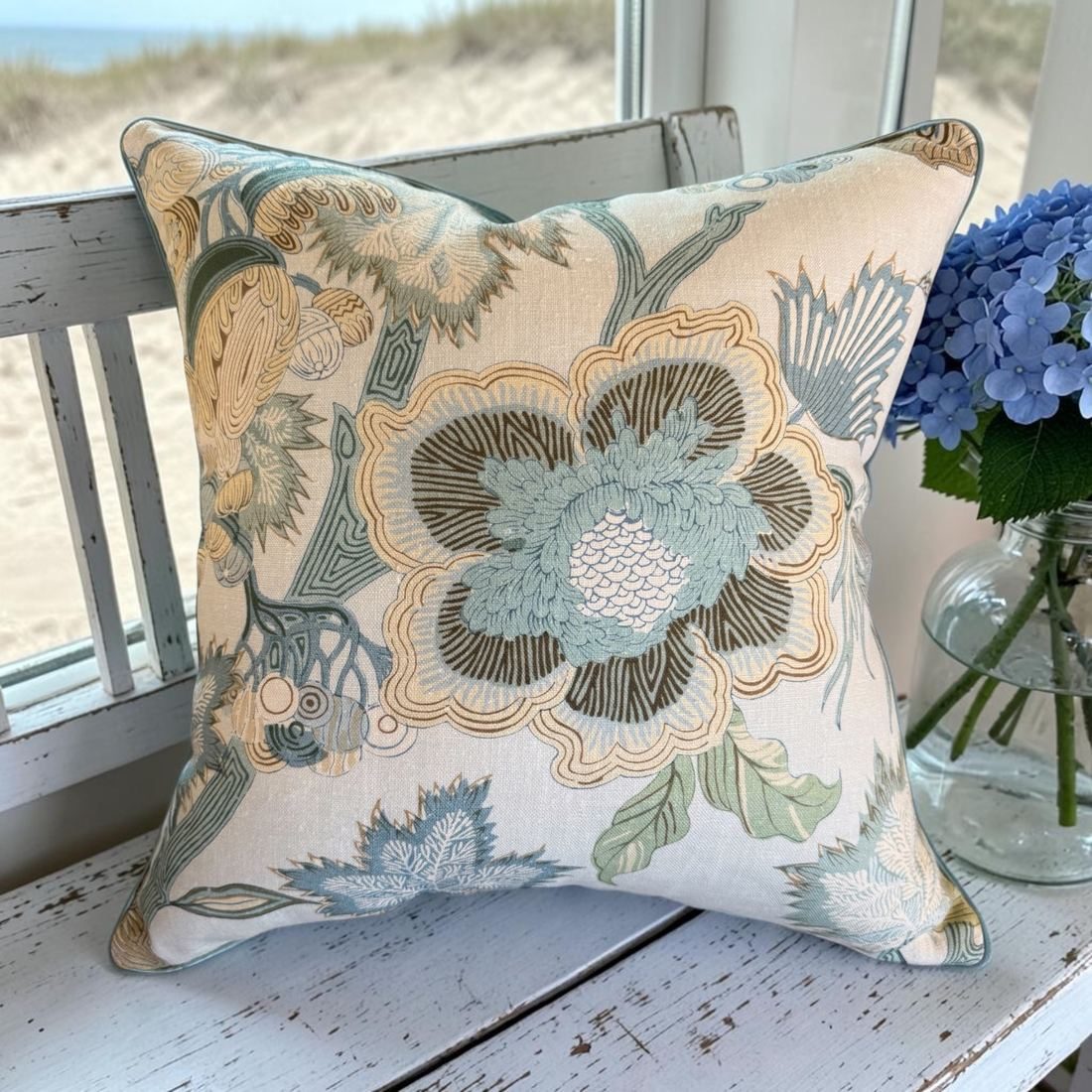 Indienne Jacobean Thibaut floral pillow on bench by window
