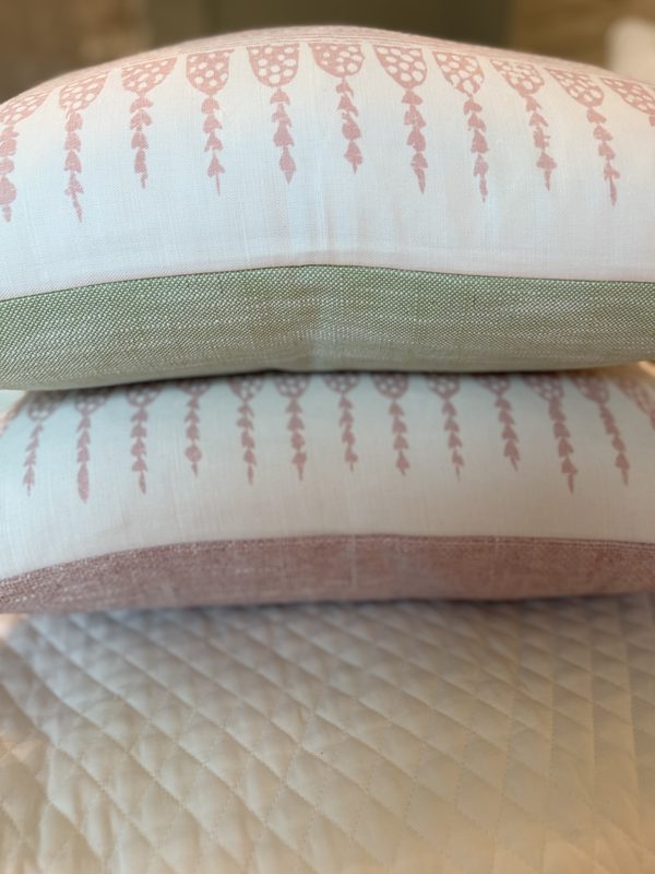 Javanese Stripe pillows stacked showing soft green and blush backings