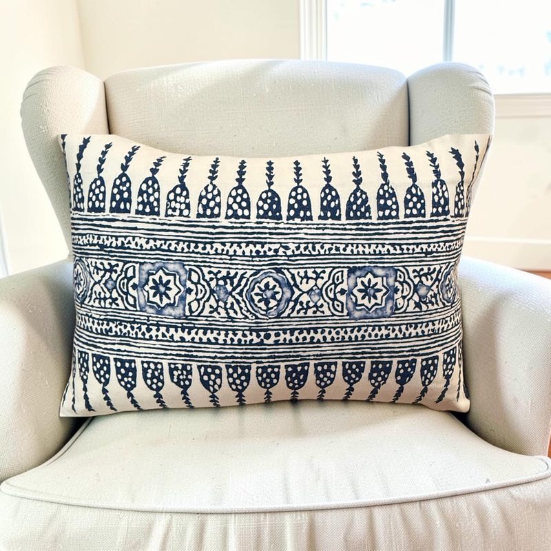 Javanese Stripe navy lumbar on ivory wing chair