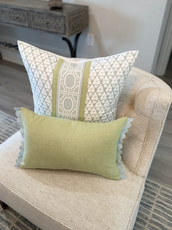 Jennifer spa blue pillow with green band and trellis tape styled with green lumbar on chair