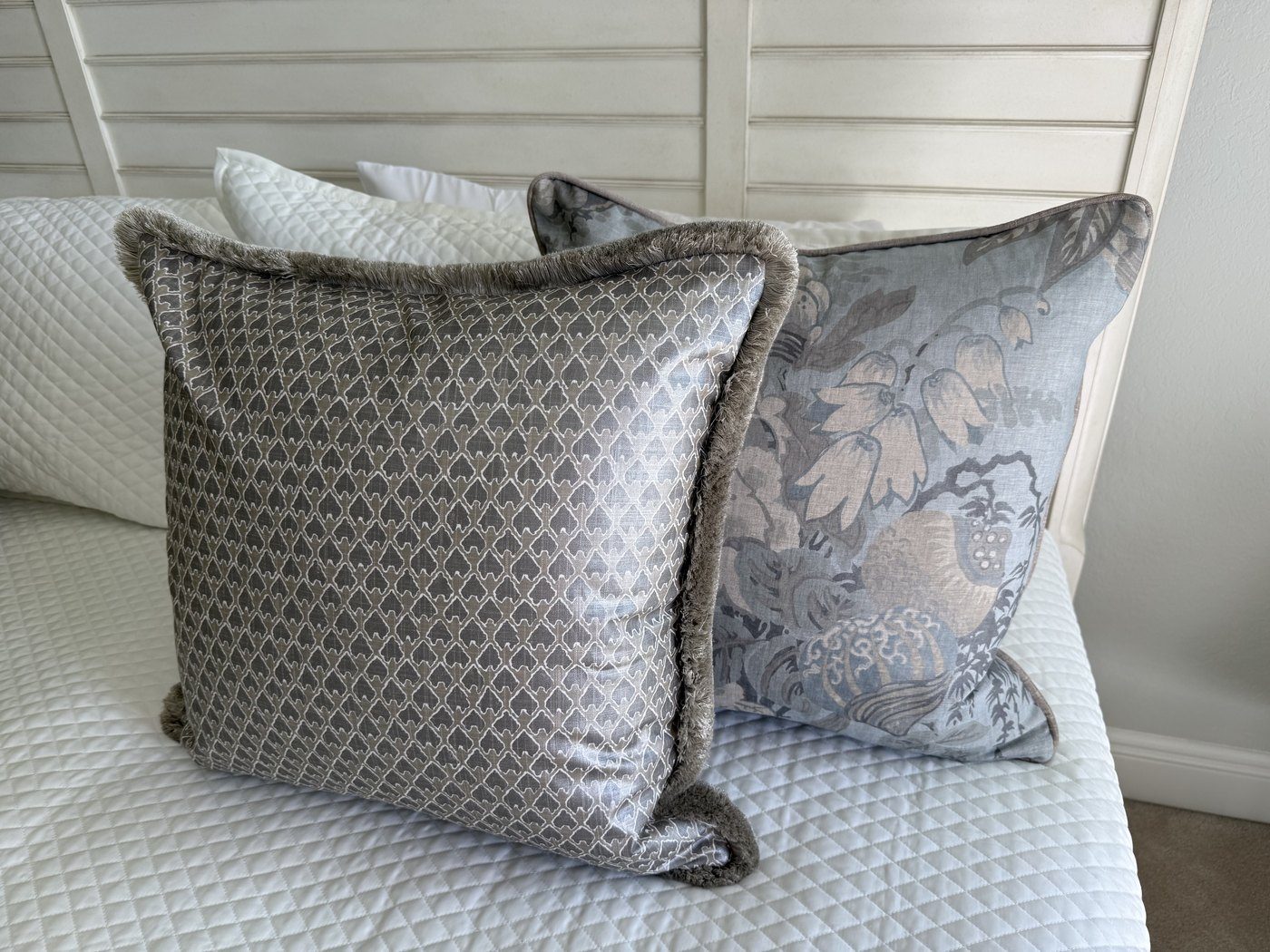 Kanapaali double-sided pewter pillow styled on bed