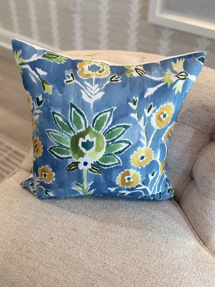 Lilia navy watercolor floral pillow styled on chair