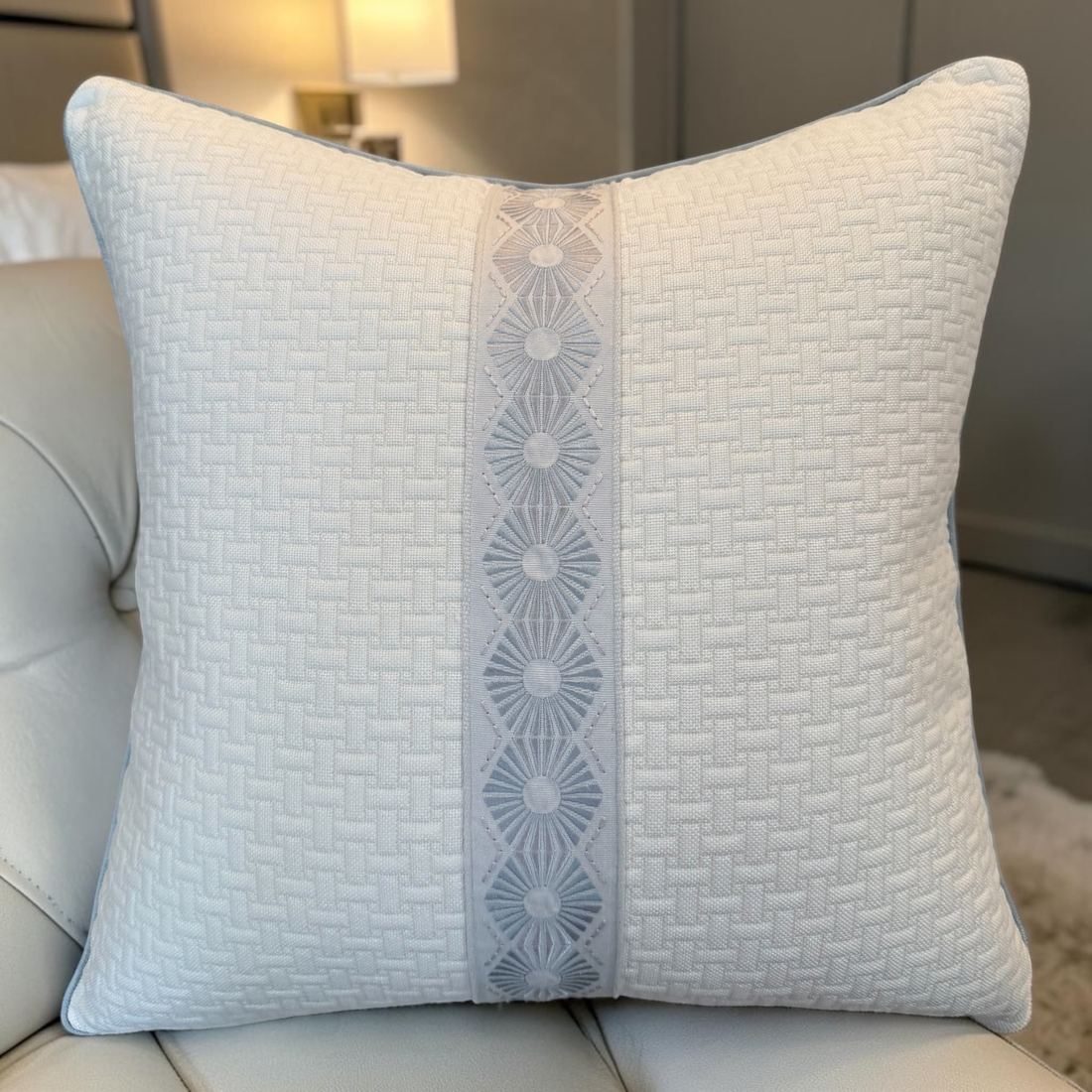 Lisa ivory textured pillow styled on chair
