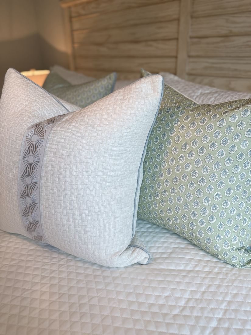 Lisa ivory pillow styled on bed