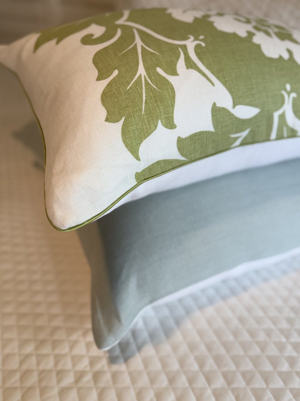 Margate pillow corner detail with green piping