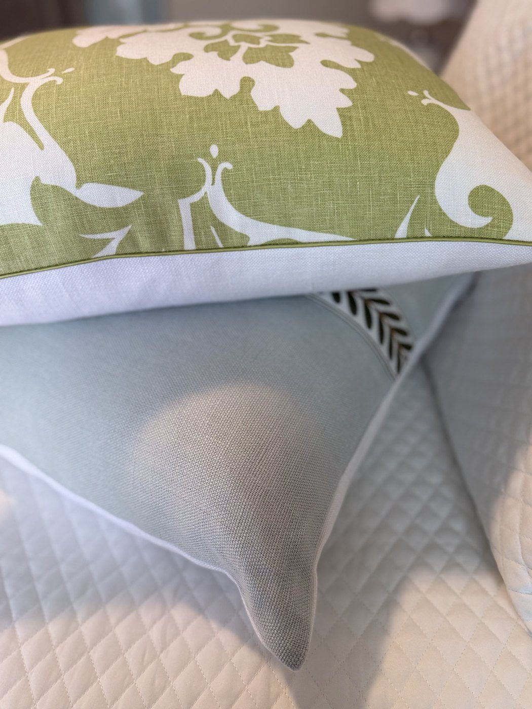 Margate green piping close-up stacked on pale blue pillow