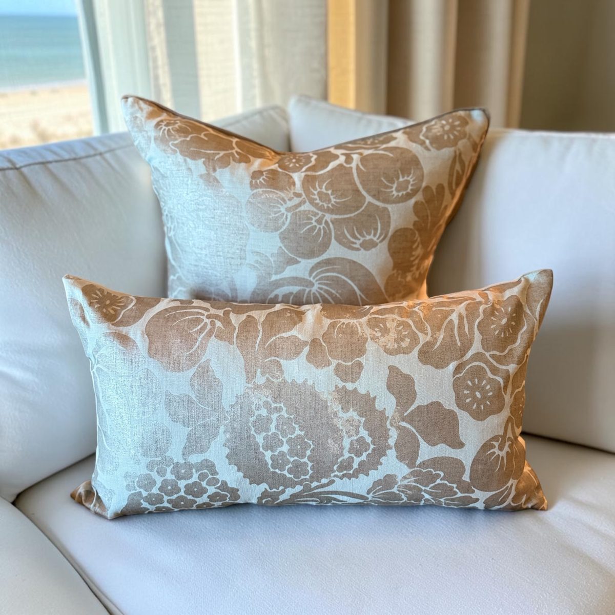 Norden Italian damask pillow and lumbar styled on white sofa with ocean view