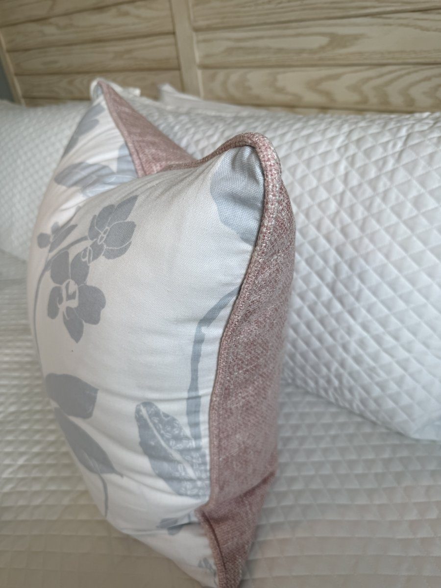 Orchids pillow side view showing blush woven piping and backing