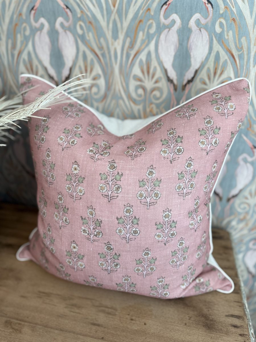 Poppy Sprig pillow styled on chair with heron print backdrop by PepperTree Designs