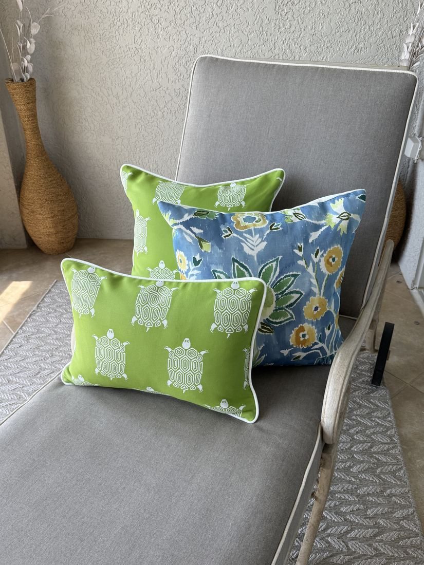 Turtle Bay indoor outdoor pillows with Lilia on lounge chair
