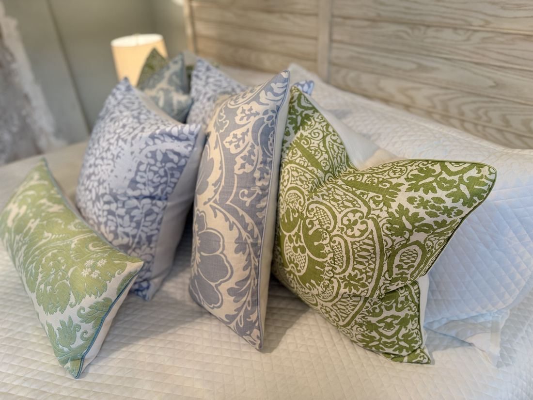 Veneto pillow collection side view on bed