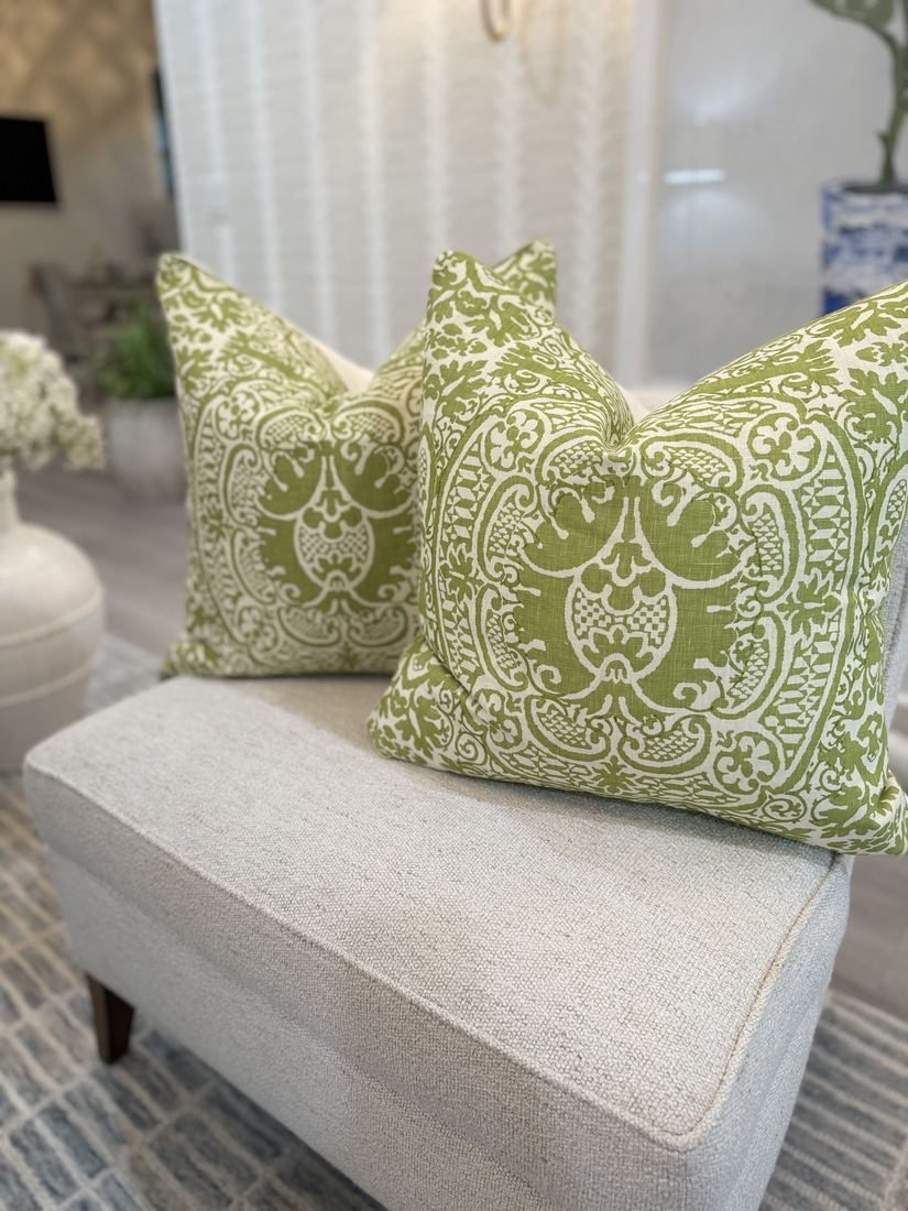 Pair of Veneto green pillows on slipper chair