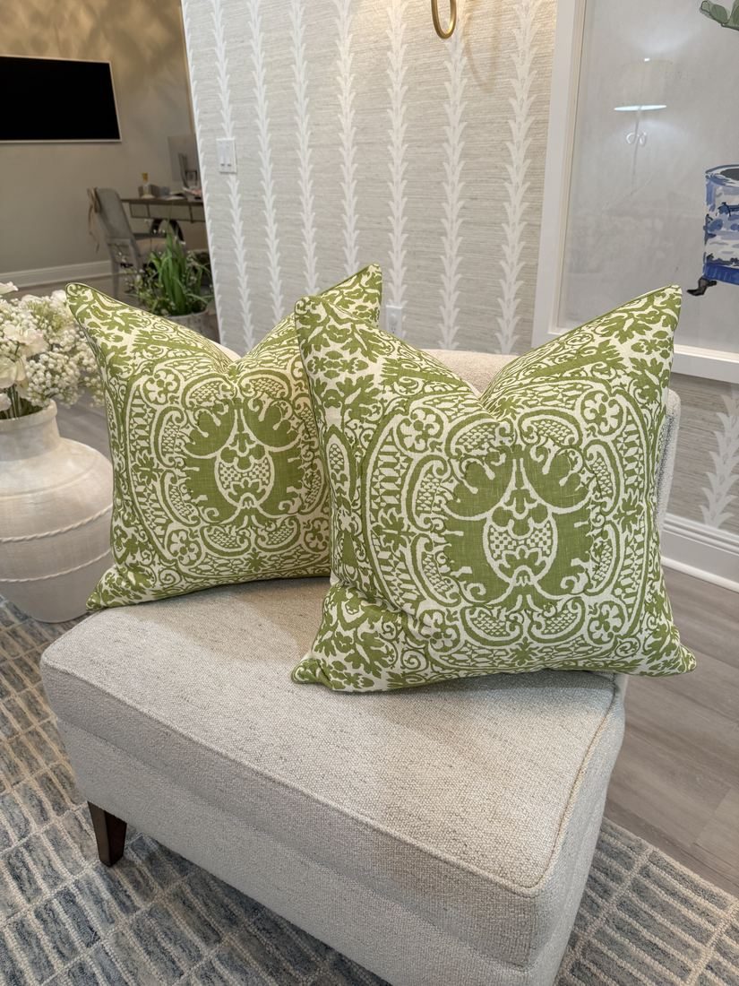 Pair of Veneto pillows styled with wallpaper backdrop