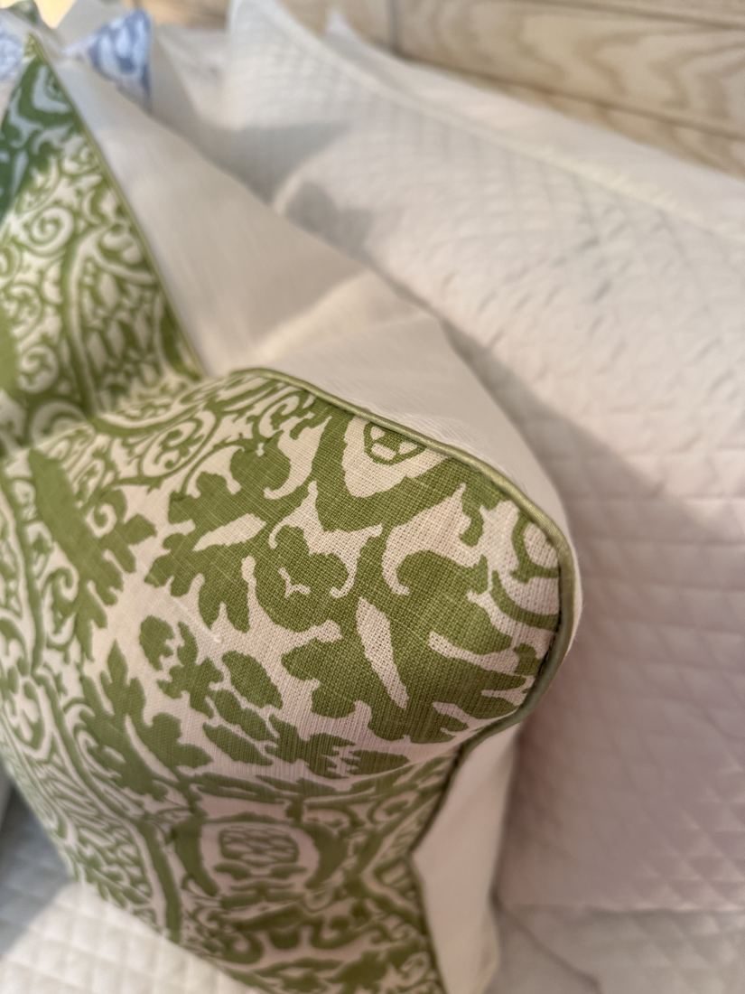 Veneto pillow corner with green trim detail